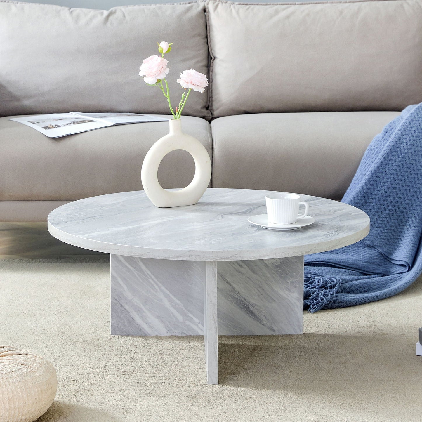 Versatile Round Coffee Table For Various Interior Styles